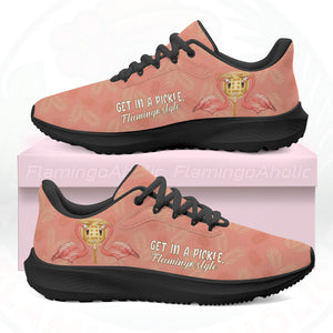 Coral pink cloud sneaker featuring tropical palm print, two flamingos in sunhats, and the text "GET IN A PICKLE, Flamingo style."