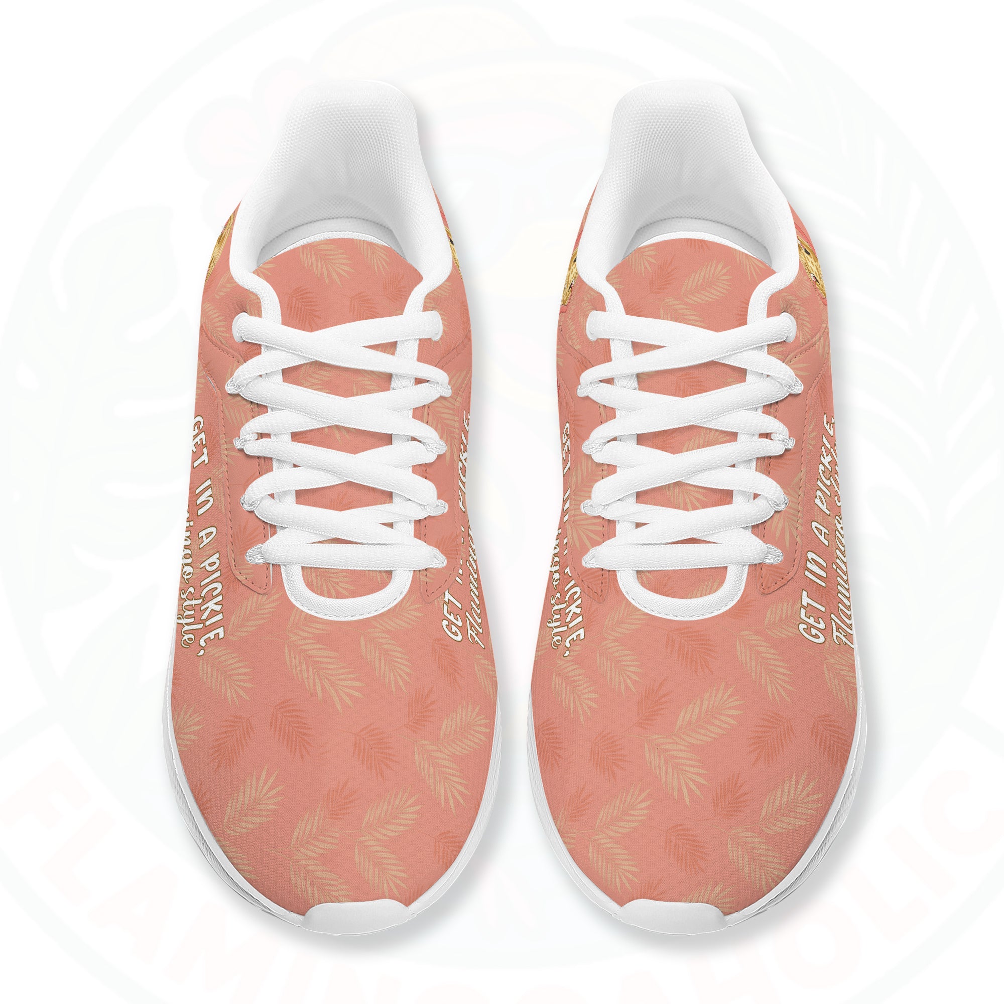 Coral pink cloud sneaker featuring tropical palm print, two flamingos in sunhats, and the text "GET IN A PICKLE, Flamingo style."