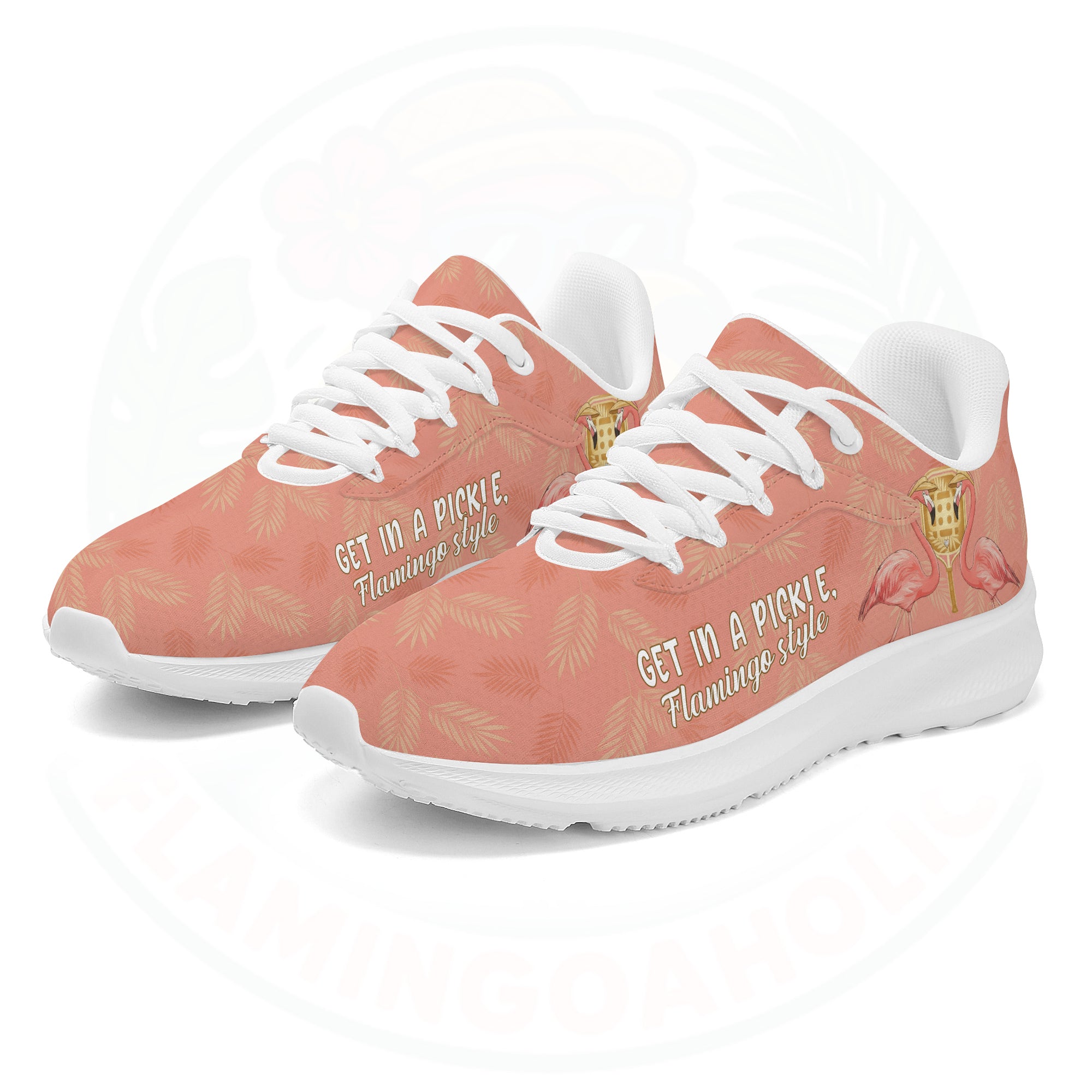 Coral pink cloud sneaker featuring tropical palm print, two flamingos in sunhats, and the text "GET IN A PICKLE, Flamingo style."