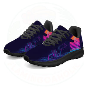 Pair of ultra-lightweight sneakers featuring a retro 80s sunset design with a neon pink flamingo and electric blue city grid on a dark navy background.